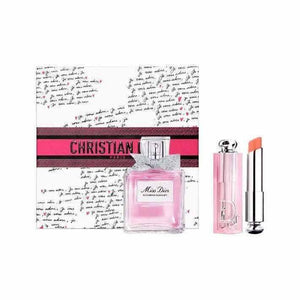 Dior Addict Lip Glow and Miss Dior fragrance set in pink packaging with floral and musk scent