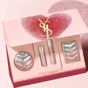 Yves Saint Laurent limited edition heart-shaped luxury makeup set with cushion foundation, eyeshadow palette, lip balm, and gold lipstick in glitter gift box