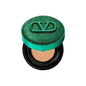 Valentino Beauty Limited Green foundation cream in a shiny green compact with logo.