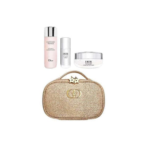 Dior Capture Anti-Aging Cream Collection limited edition with silver serum, pink lotion, white moisturizer, and gold starry makeup bag