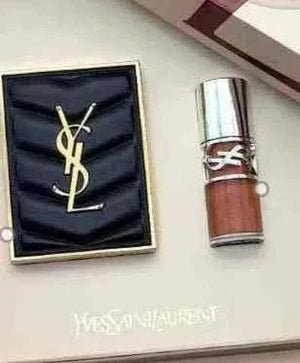 YSL Pink Marble Limited Edition makeup set with pink marble design, including eyeshadow palette and lipstick in luxury packaging