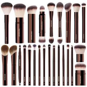 Luxury bronze professional makeup brushes set with synthetic fibers and ergonomic handles for foundation, powder, eyeshadow, and contouring
