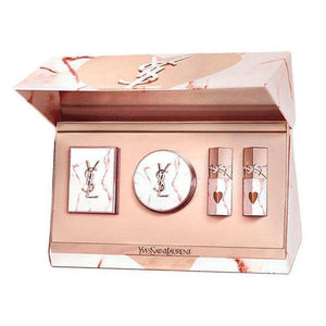 YSL Saint Laurent limited makeup set with pink marble packaging, gold accents, eyeshadow palette, air cushion, and liquid lipsticks in luxury gift box