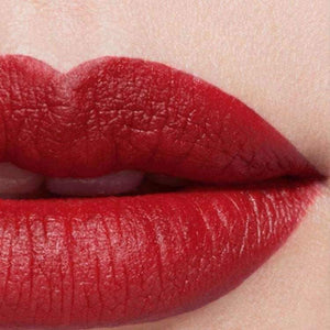 Close-up swatch of CHANEL deep red luminous matte lipstick.