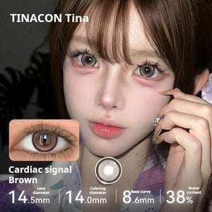 Model showcasing Tinacon Cardiac Signal Brown contact lenses with 38 percent water content and a soft gradient pattern.