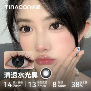 Close-up of a model wearing Tinacon Clear Water Black glossy contact lenses with 38 percent hydration for a deep look.
