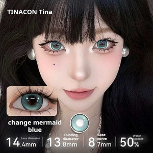 A close-up of a model wearing Tinacon Mermaid Blue contact lenses with 14.4mm diameter, showing the vibrant icy blue color on dark eyes.