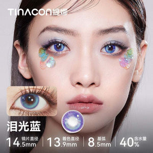 Model showcasing Tinacon Tears Blue aesthetic contact lenses with a soft gradient design and 40 percent water content.