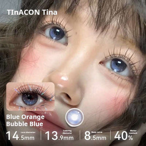 Close-up of an eye wearing Blue Orange Bubble Blue lenses, displaying a vibrant ocean blue tone. Specs: 14.5mm diameter, 13.9mm graphic diameter, 8.5mm base curve, 40% water content.