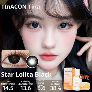 Close-up of an eye wearing Star Lolita Black lenses, providing a sharp, high-definition black doll-eye effect. Specs: 14.5mm diameter, 13.6mm graphic diameter, 8.6mm base curve, 38% water content.