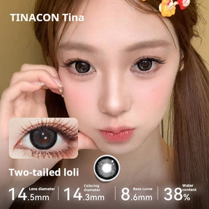 Model showcasing Tinacon Two-tailed Loli brown contact lenses with a prominent anime eye widening effect.