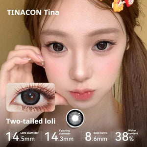 Model showcasing Tinacon Two-tailed Loli brown contact lenses with a prominent anime eye widening effect.