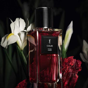 عطر سان لوران COEUR مع زهور السوسن البيضاء والورود الحمراء