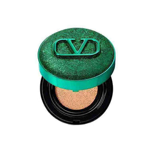 Valentino Beauty Limited Green foundation cream in a shiny green compact with logo.