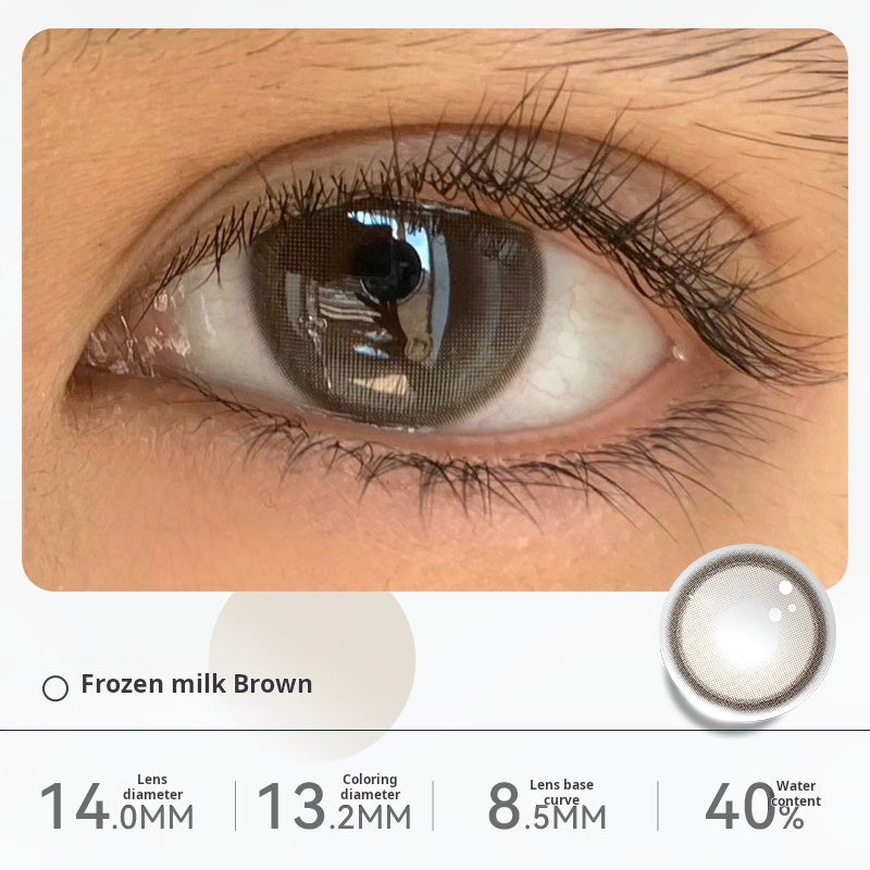 Close-up of an eye wearing "Frozen milk Brown" contact lenses, displaying a light, creamy hazel tone. Specifications: 14.0mm diameter, 13.1mm graphic diameter, 8.5mm base curve, 40% water content.