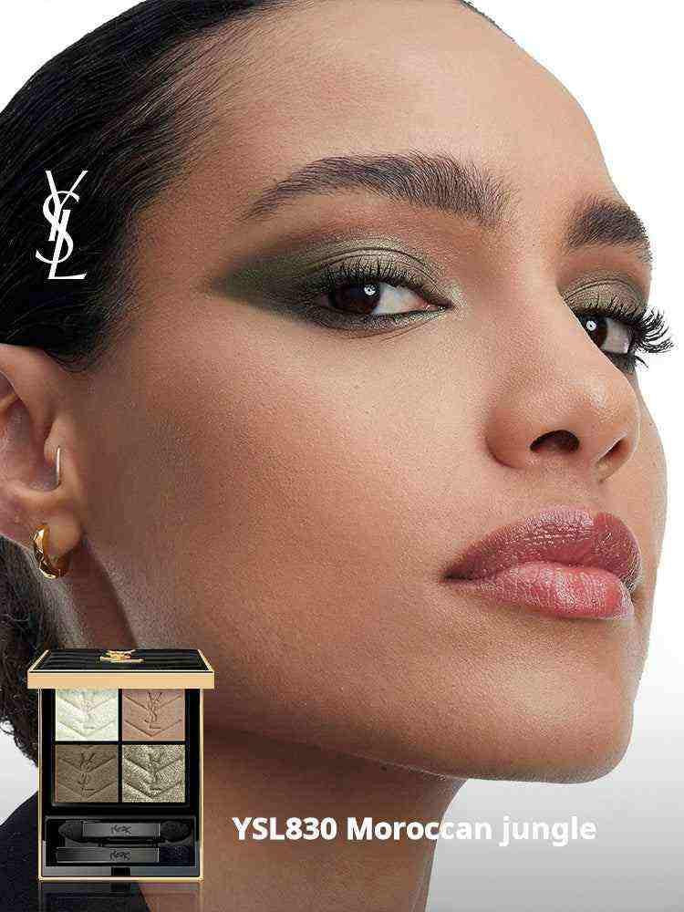 Close-up of a woman wearing YSL Couture Color Eyeshadow in YSL830 Moroccan Jungle with an elegant gold and black eyeshadow palette beside her.