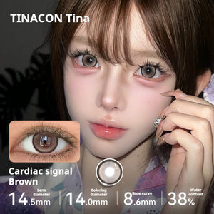 Model showcasing Tinacon Cardiac Signal Brown contact lenses with 38 percent water content and a soft gradient pattern.