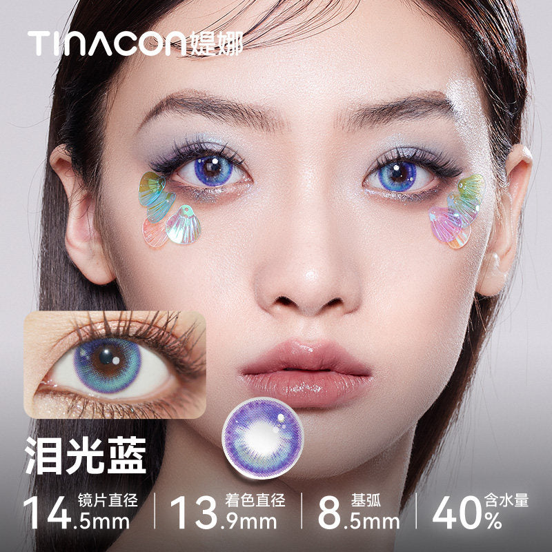 Model showcasing Tinacon Tears Blue aesthetic contact lenses with a soft gradient design and 40 percent water content.